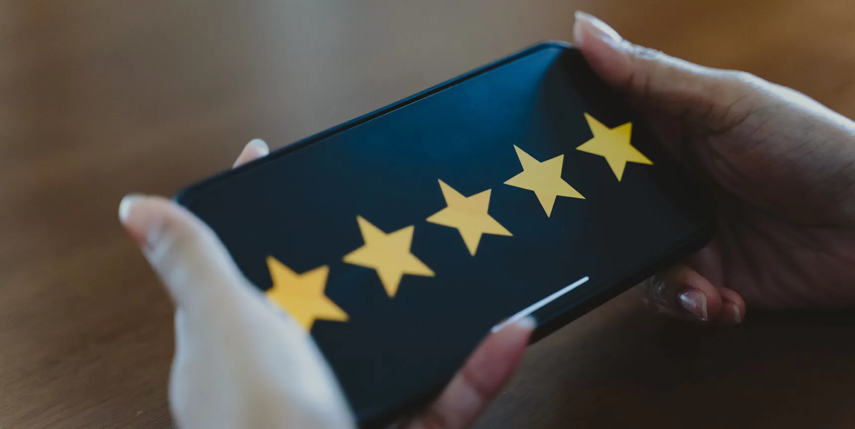 Five yellow stars on smartphone screen
